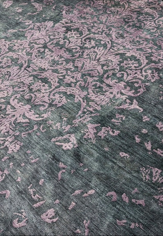 Authentic oriental rug with a damask pattern in black and purple