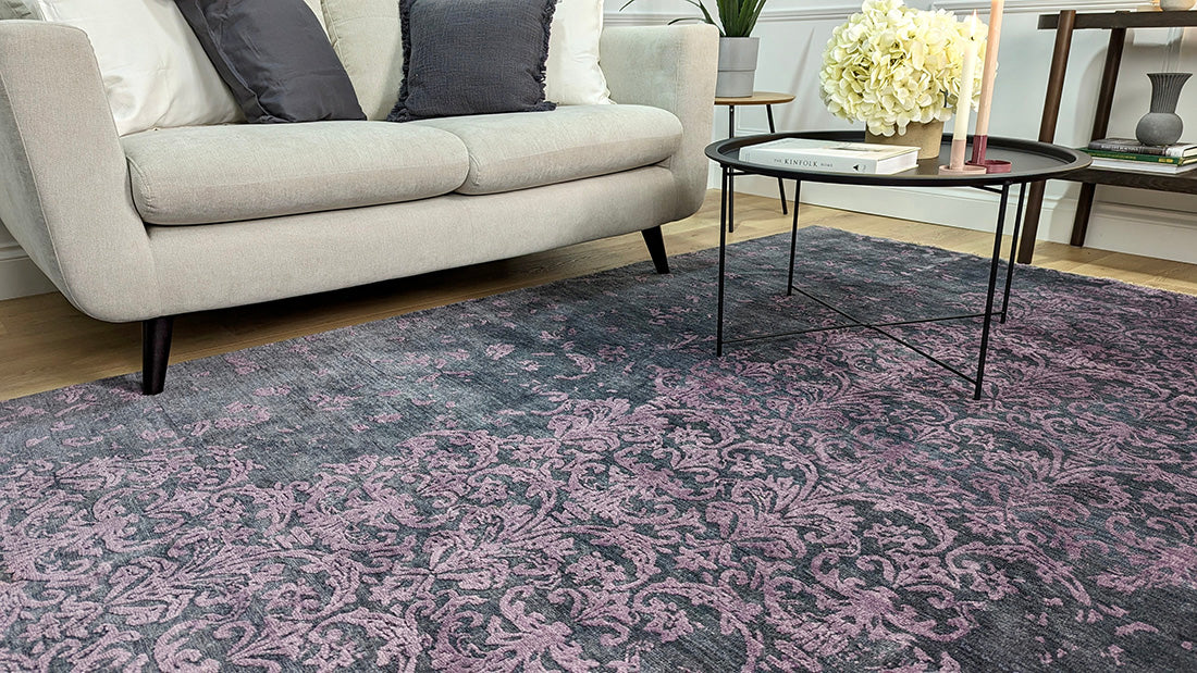 Authentic oriental rug with a damask pattern in black and purple