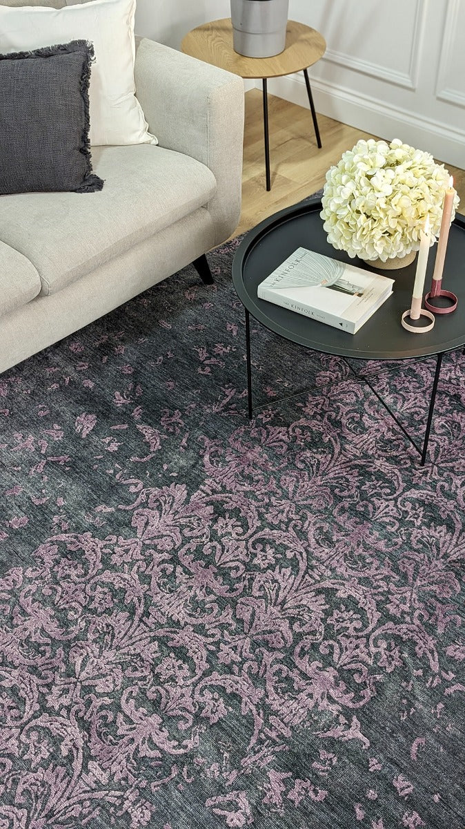 Authentic oriental rug with a damask pattern in black and purple