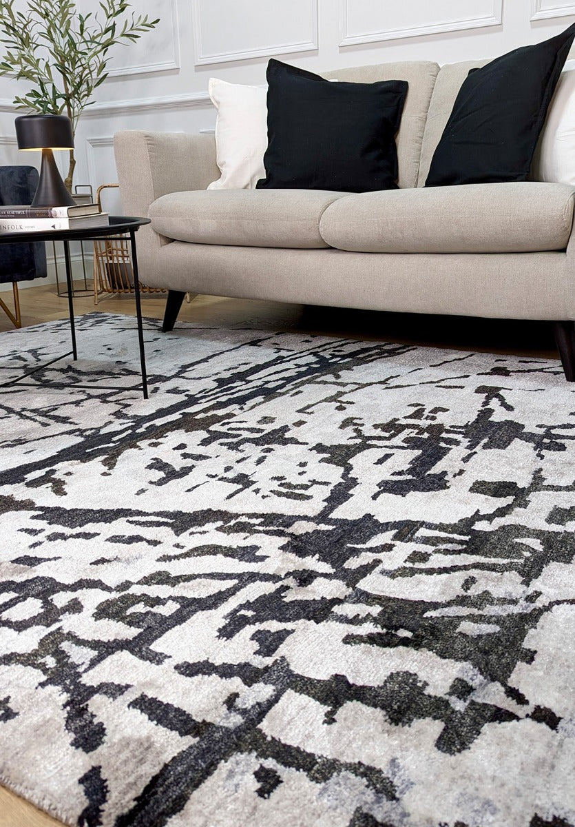 oriental rug with an abstract traditional pattern in grey