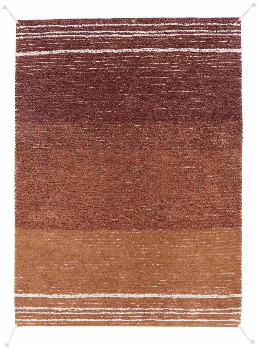 reversible textured rug in beige and brown with soft gradient design