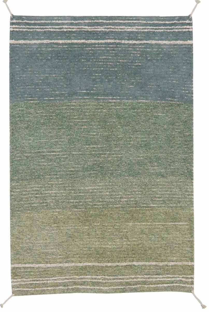 reversible textured rug in beige and blue with soft gradient design
