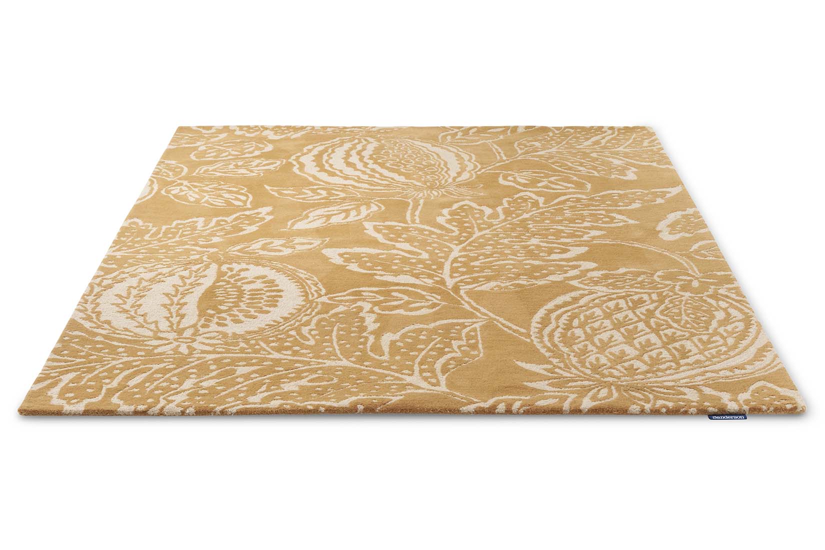 ochre wool rug with exotic fruit inspired design
