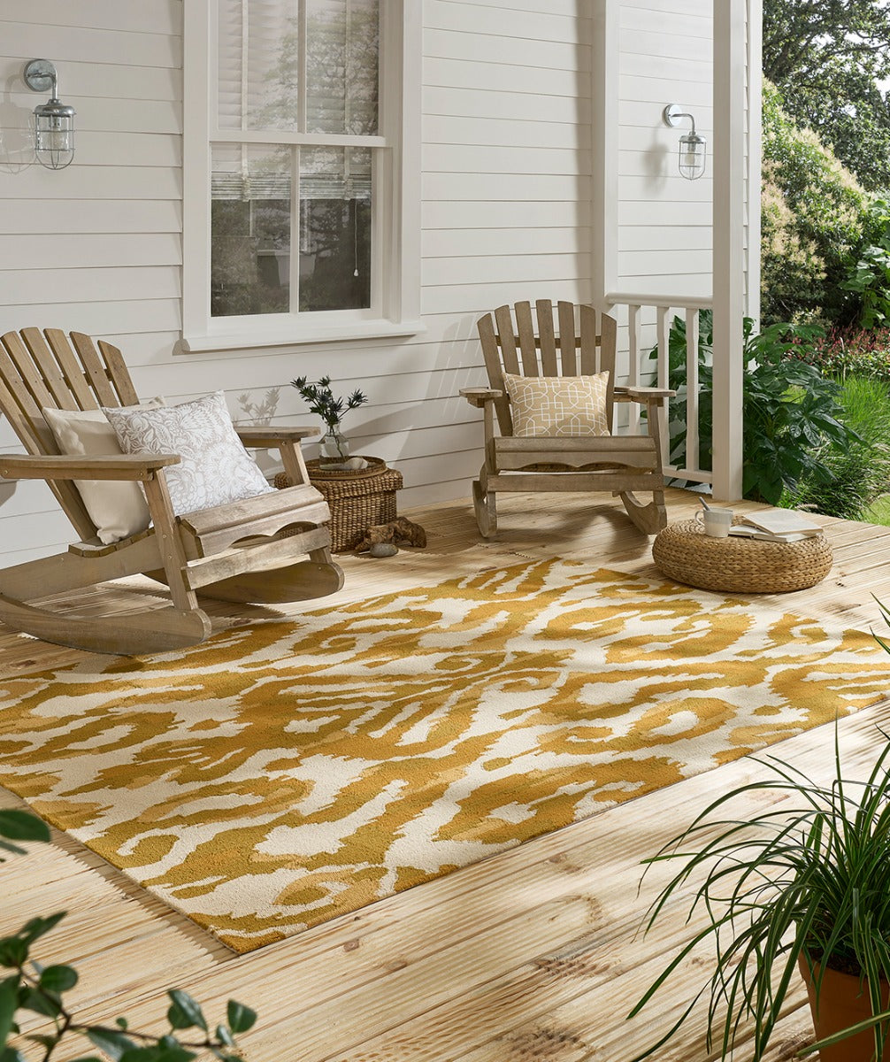 yellow indoor/outdoor rug with abstract pattern
