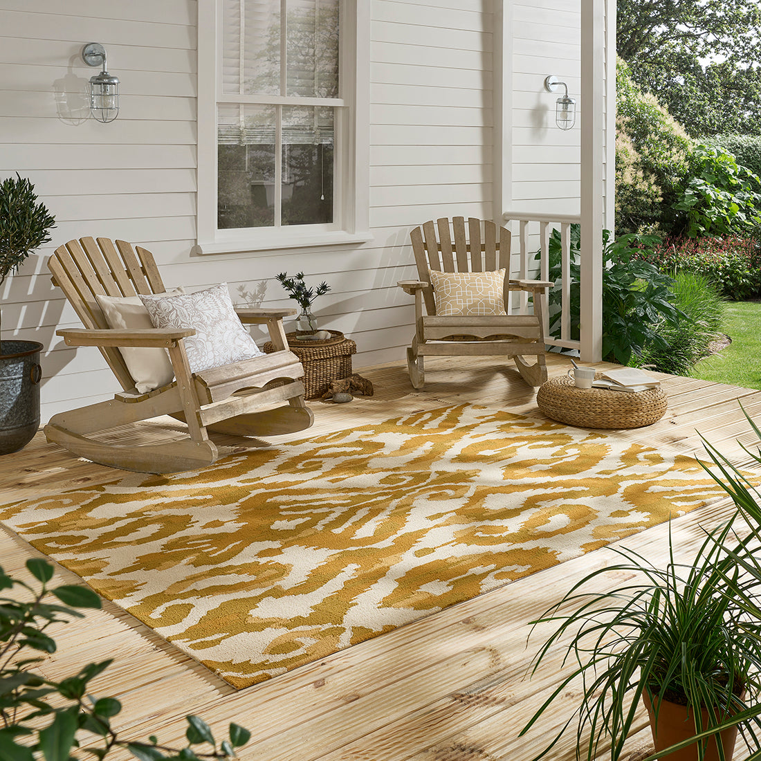 yellow indoor/outdoor rug with abstract pattern
