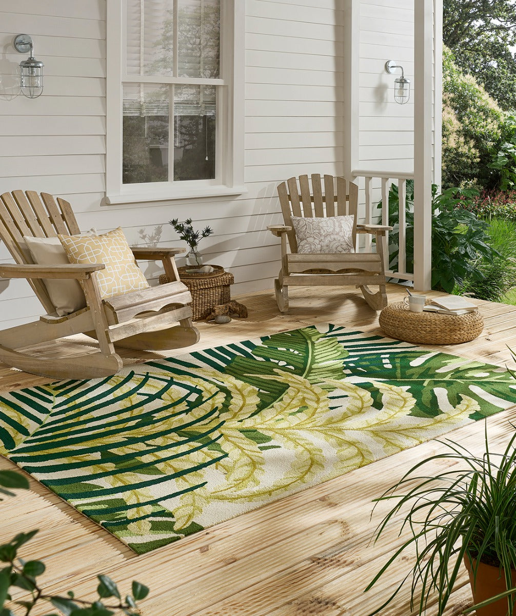 green indoor/outdoor rug with floral pattern
