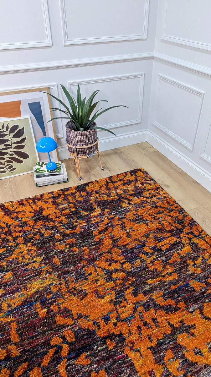 orange and purple rug woven from recycled sari silks