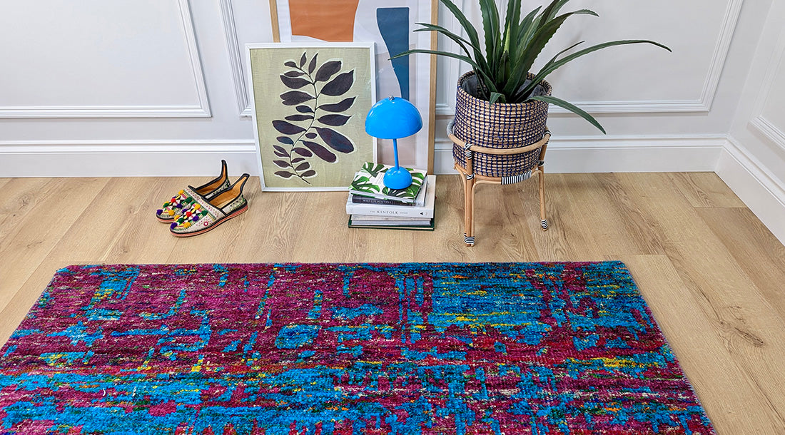 blue and pink rug woven from recycled sari silks 