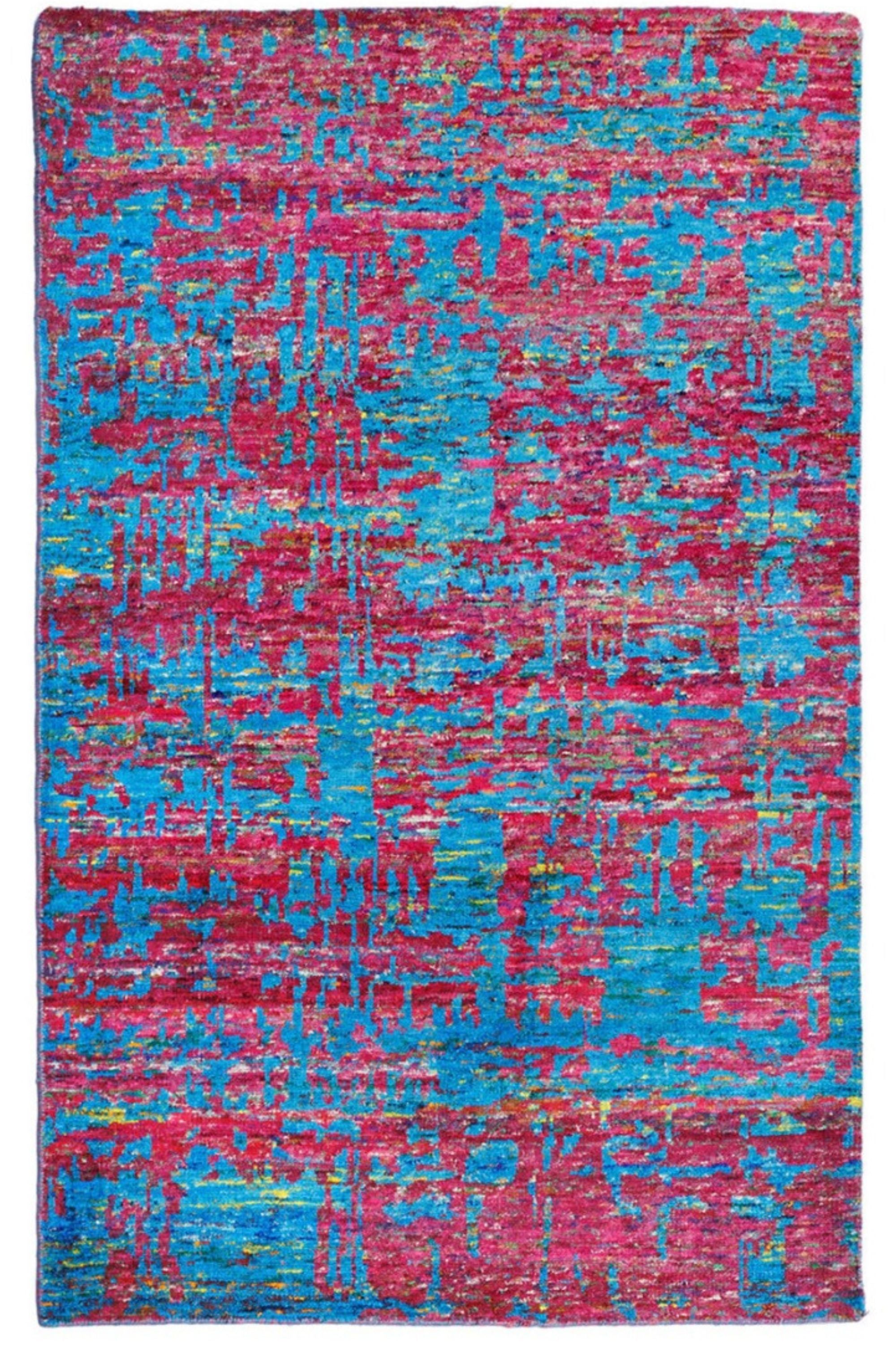 blue and pink rug woven from recycled sari silks