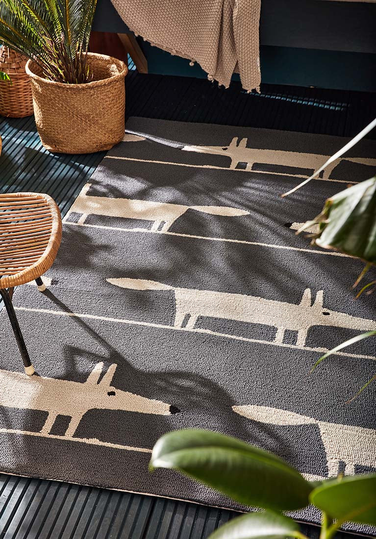 grey indoor/outdoor rug with oversized floral print
