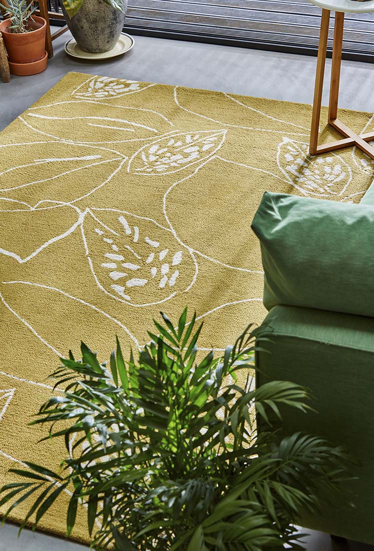 yellow rug with floral pattern
