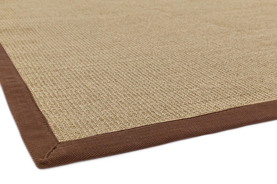 beige sisal rug with a brown border