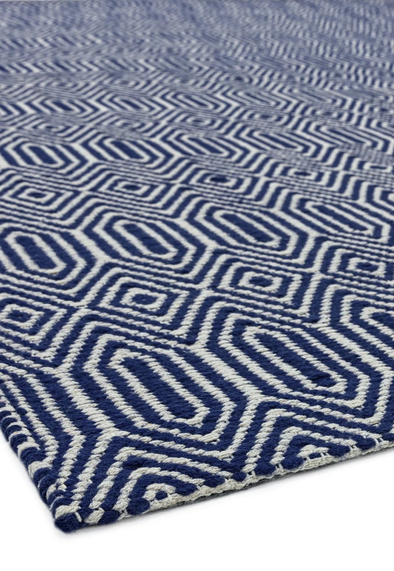 blue and white woven rug with aztec chevron pattern