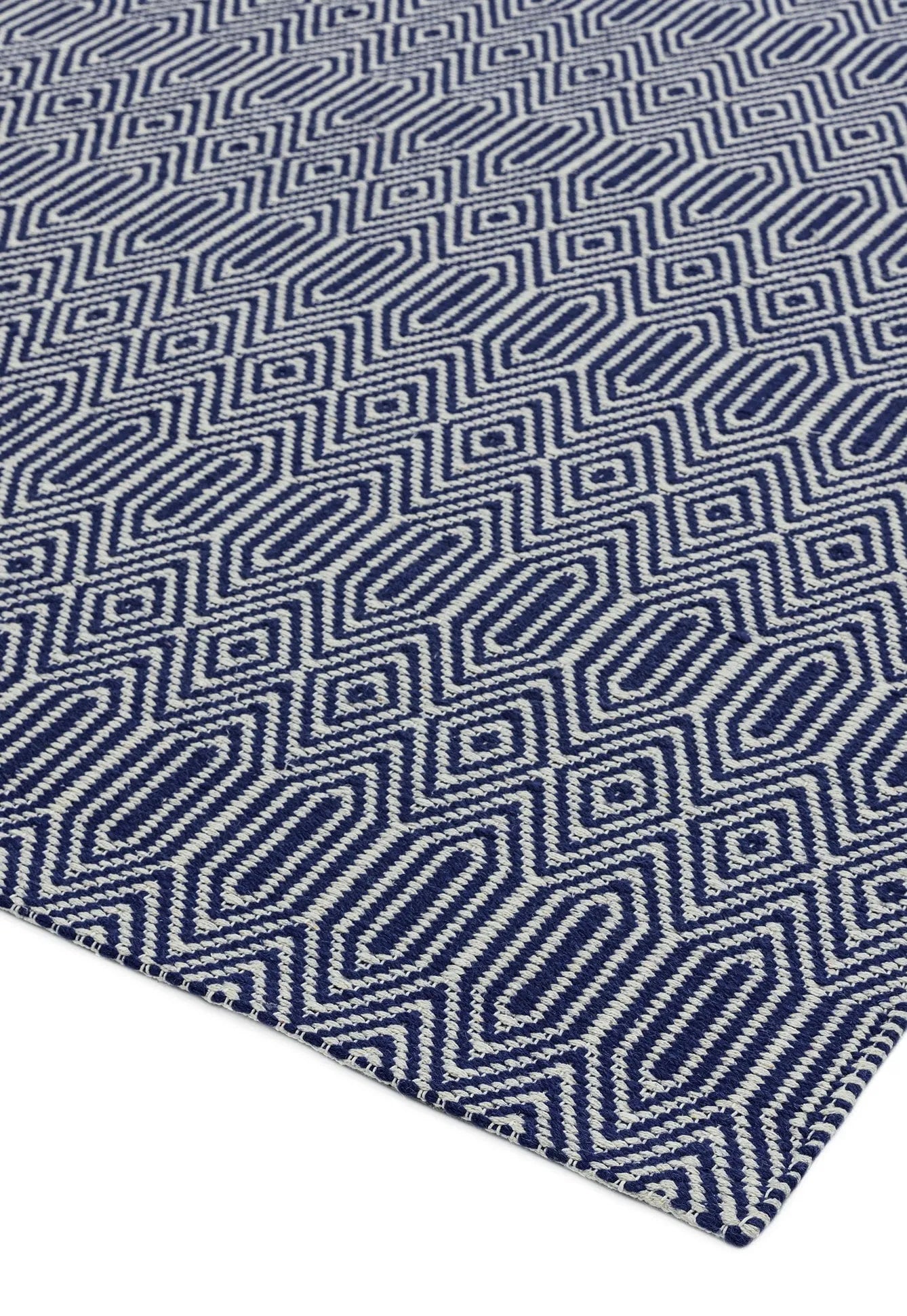 blue and white woven rug with aztec chevron pattern