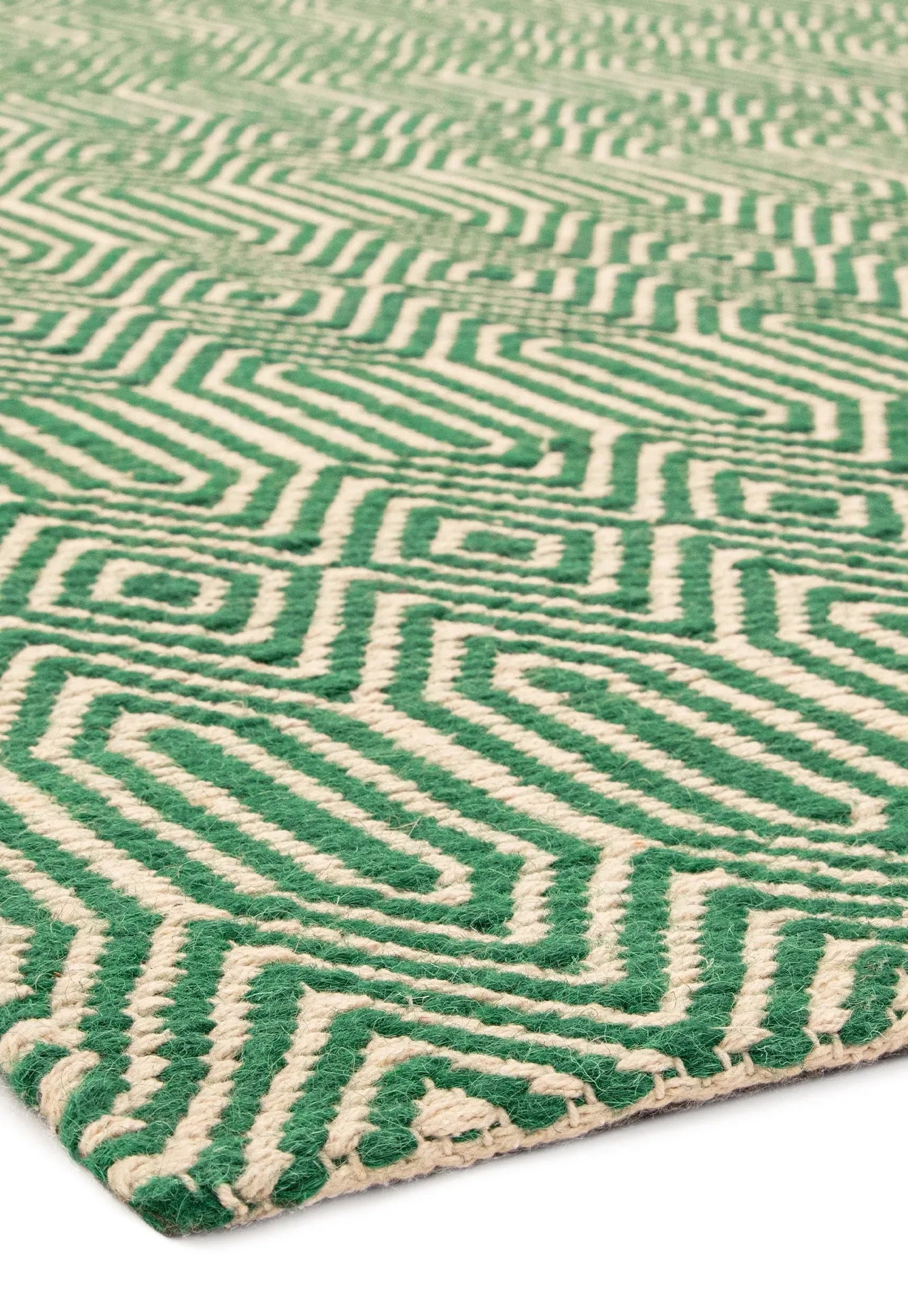 Green woven rug with aztec chevron pattern