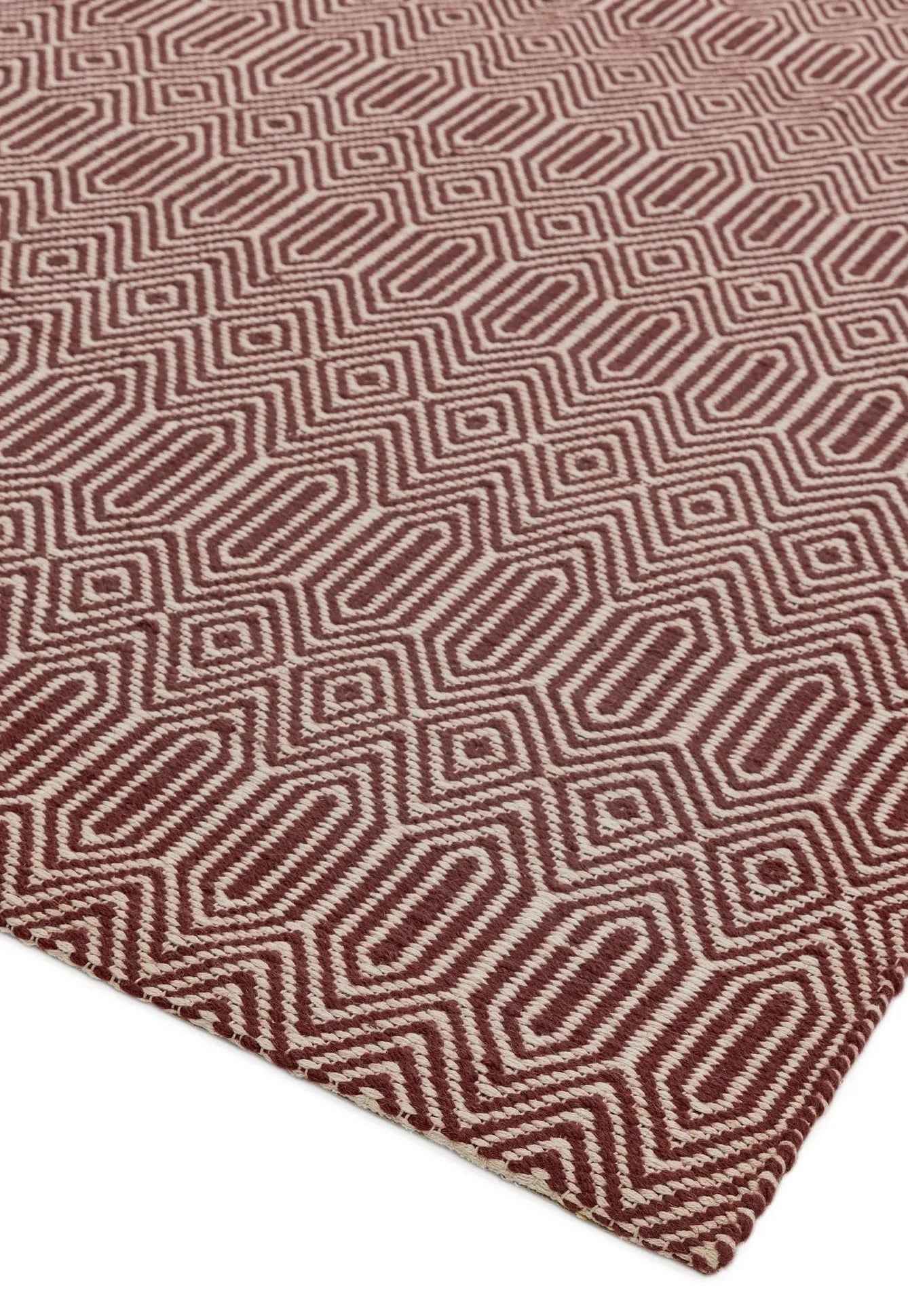 red and white woven rug with aztec chevron pattern