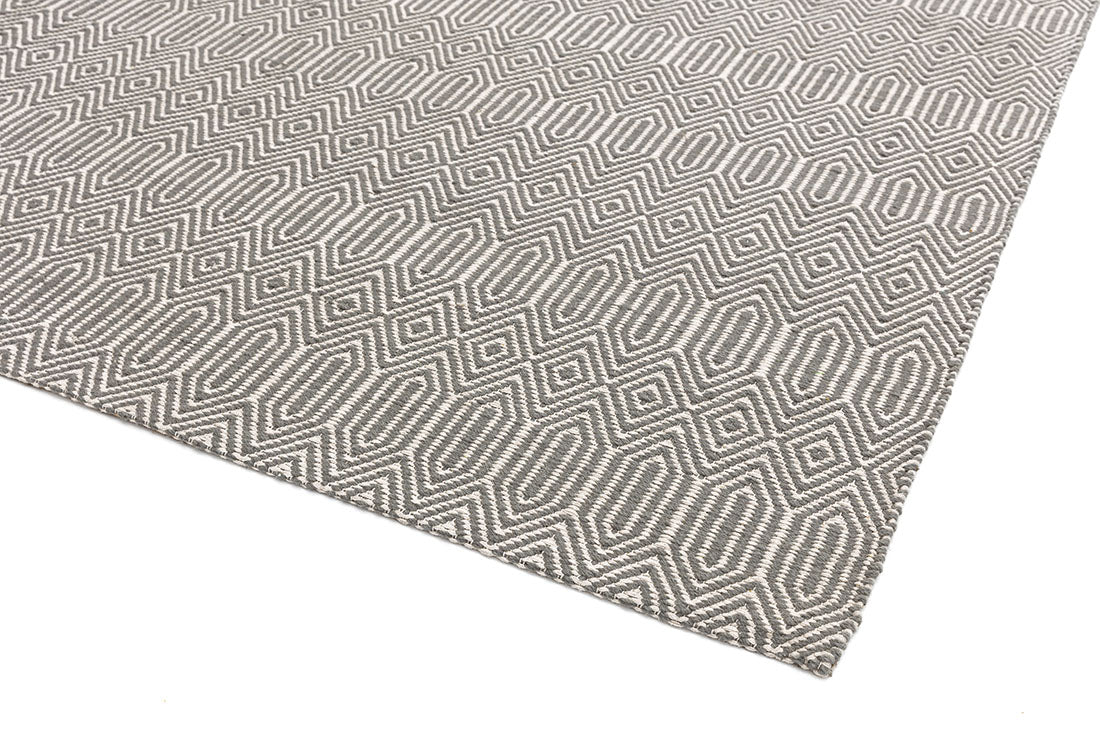 silver and white rug with aztec chevron pattern