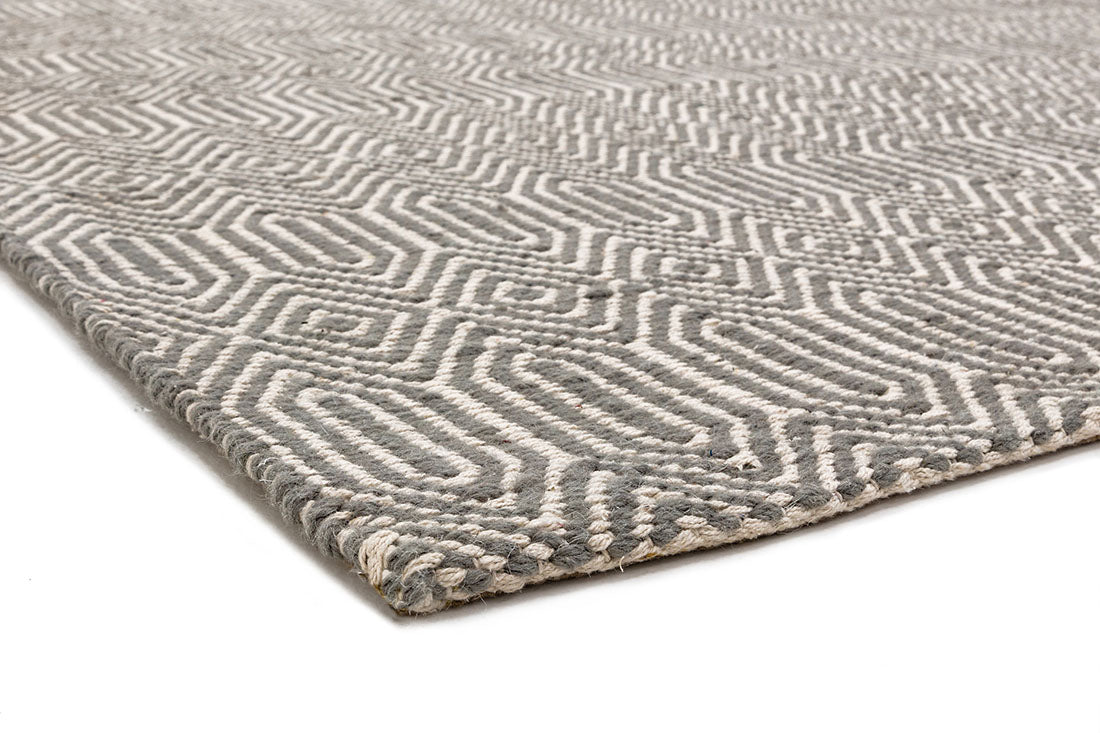 taupe and white runner with a geometric aztec pattern