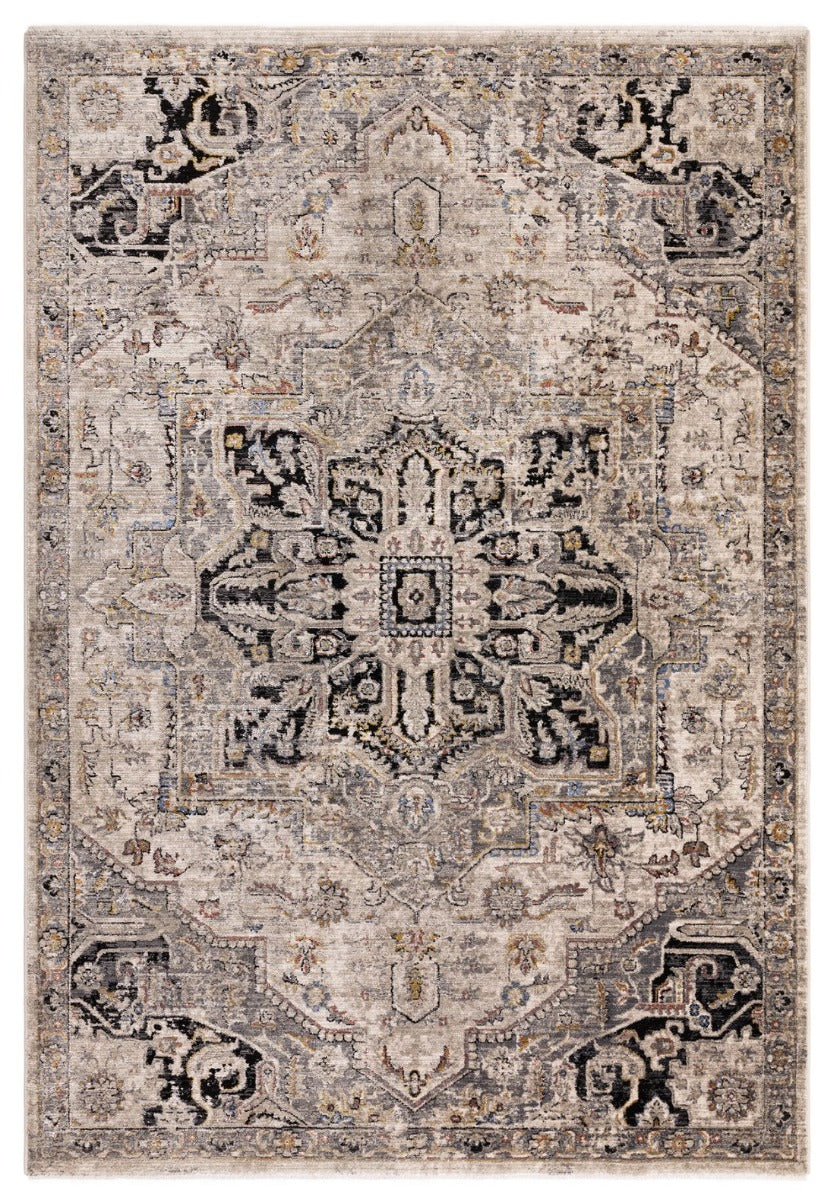 Vintage style distressed rug in shades of grey, beige and black
