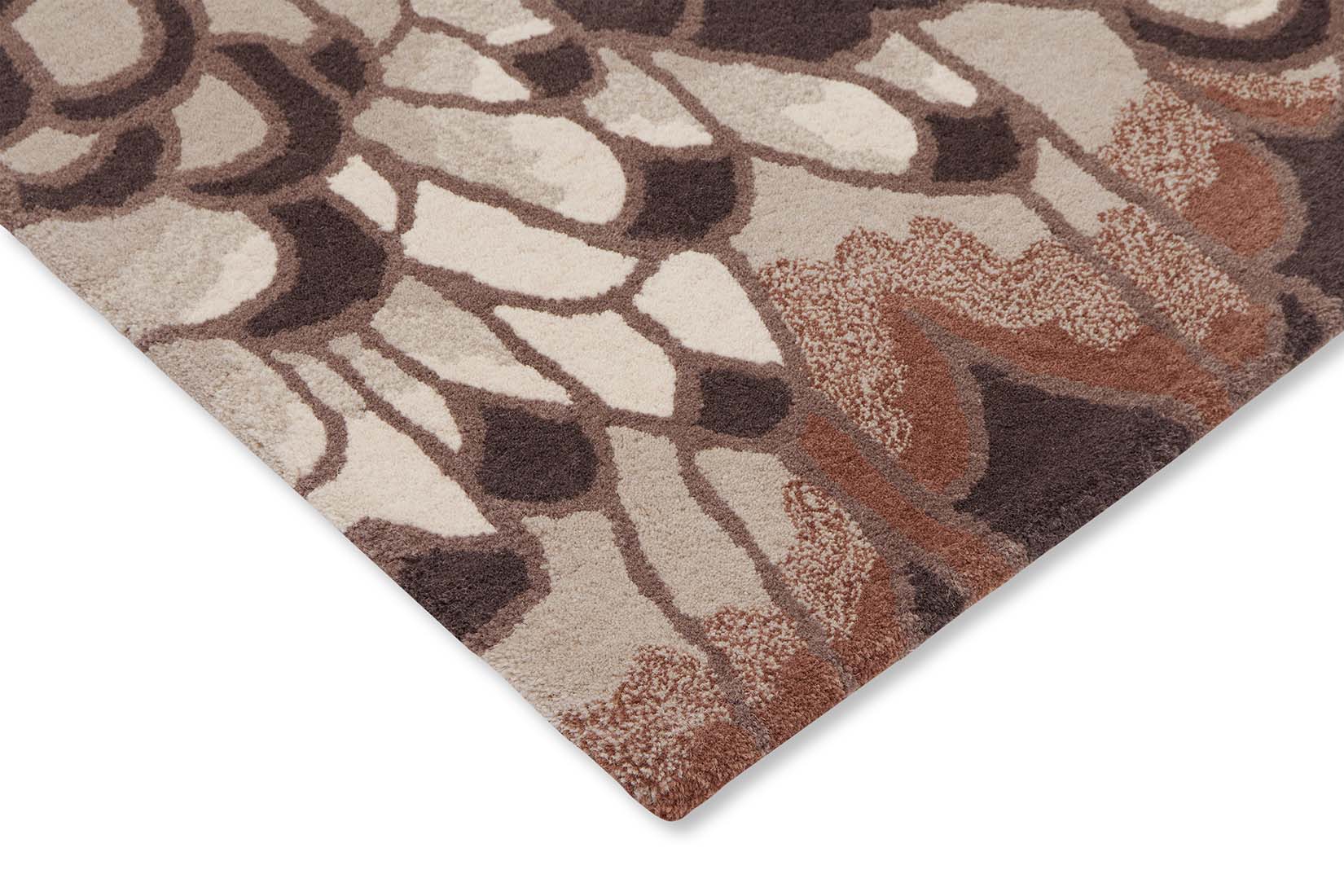 brown wool rug with feather pattern
