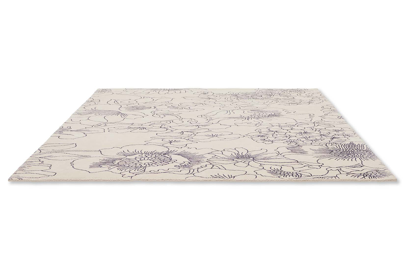 cream cotton rug with floral pattern in blue
