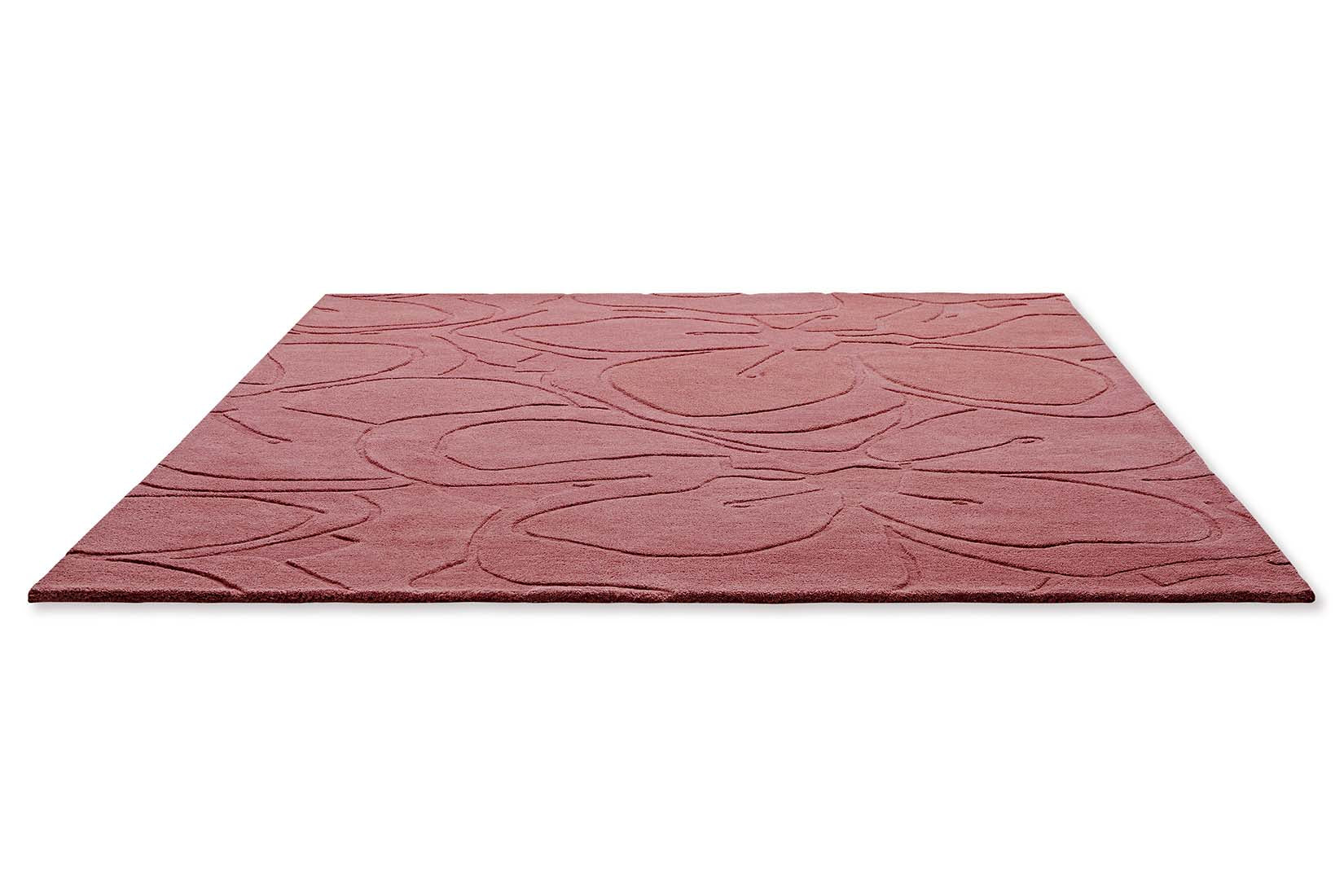 pink wool rug with floral shapes 
