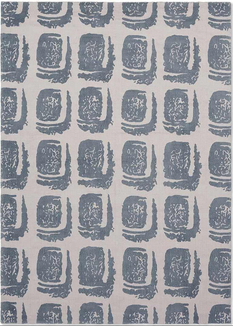 grey cotton rug with abstract blue squares
