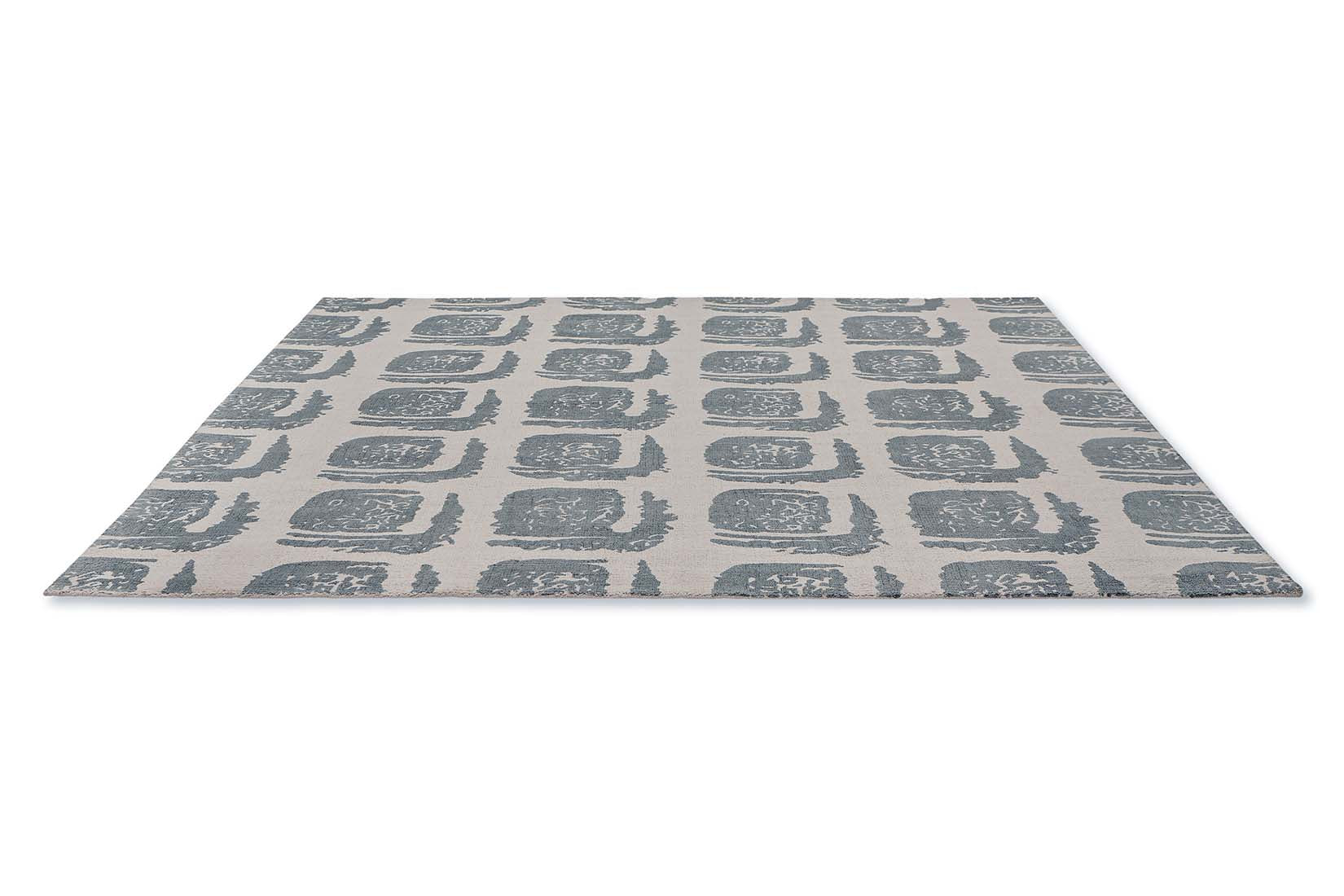grey cotton rug with abstract blue squares
