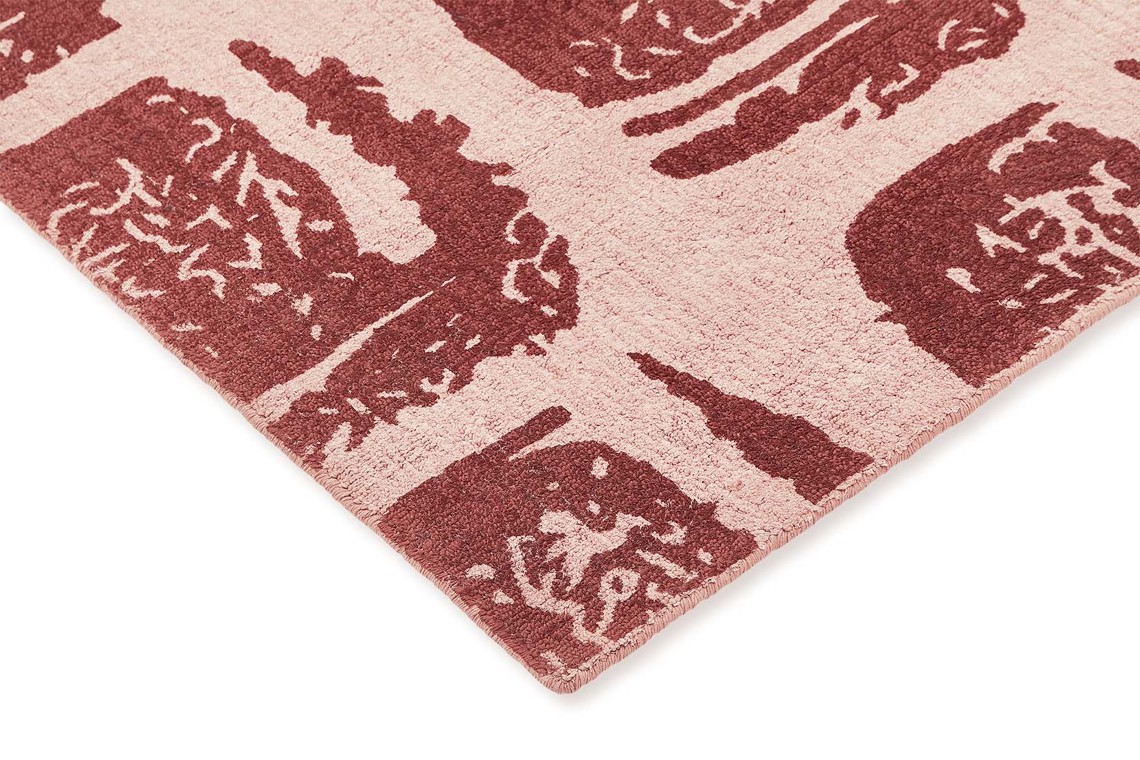 pink cotton rug with abstract red squares
