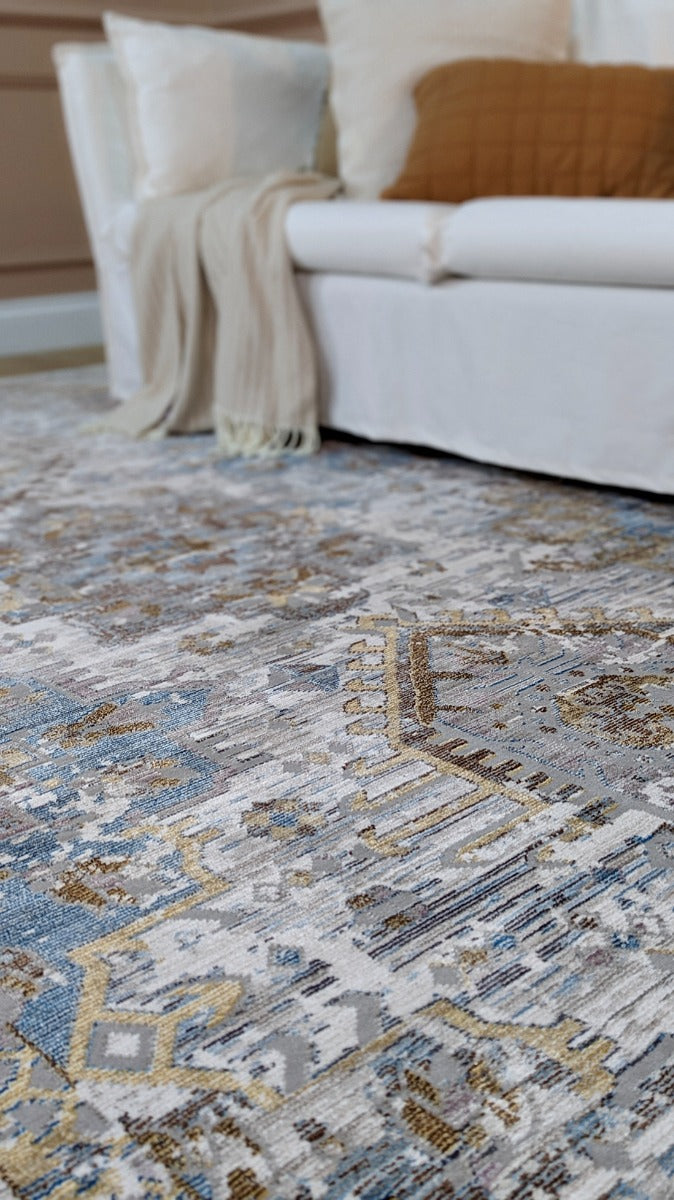 Persian style area rug in beige, blue and gold