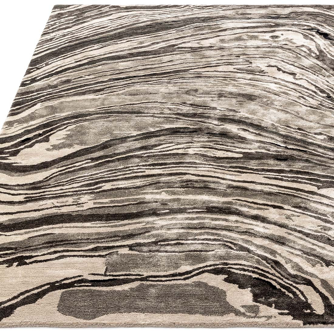 black and beige handtufted abstract rug in a marble design
