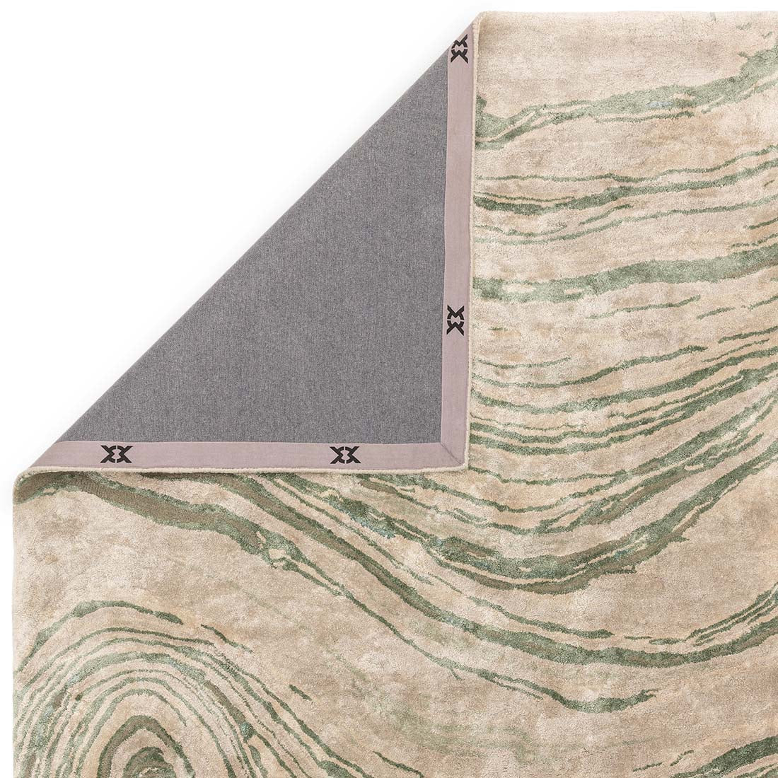green and beige handtufted abstract rug in a marble design
