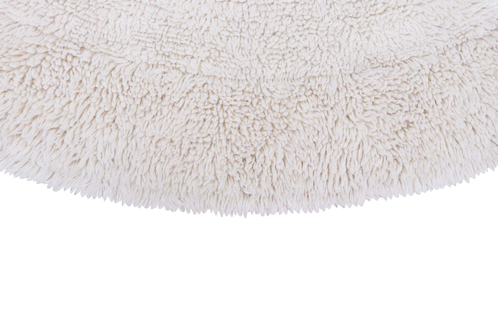 round cream washable wool rug 

