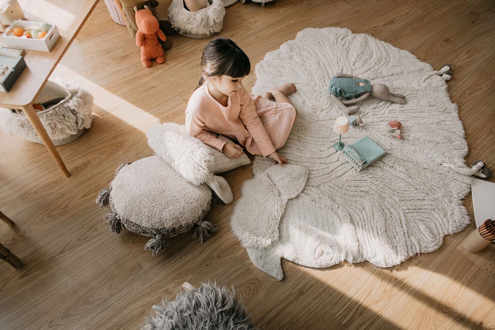 cream sheep shaped wool rug

