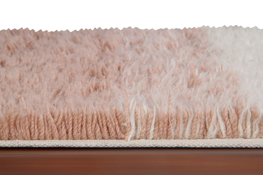 lorena canals washable wool rug with a simple block design in pink and beige