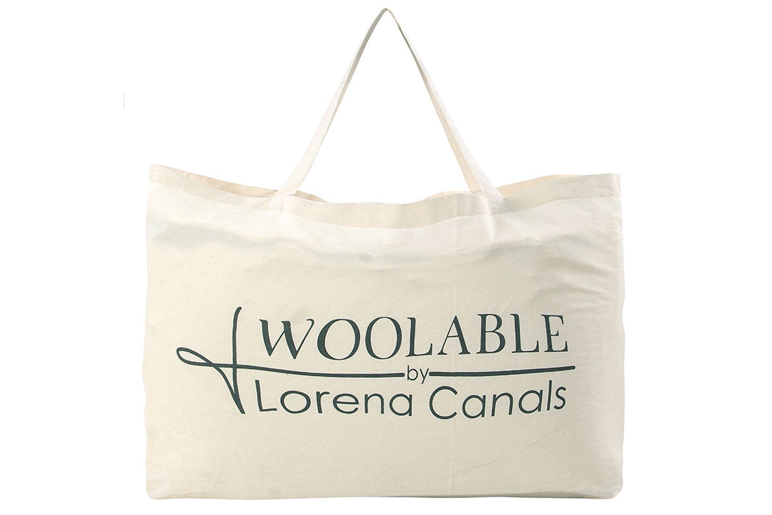 bohemian lorena canals woolable rug with a simple abstract design in beige