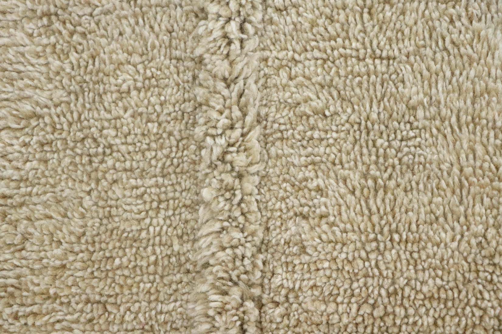 beige washable wool rug with textured detail
