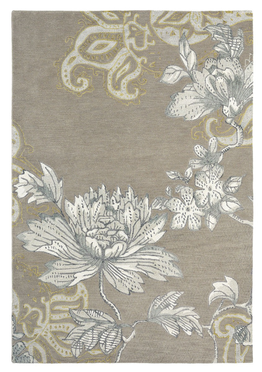 Rectangular grey rug with white floral design, paisley details and engraved shapes