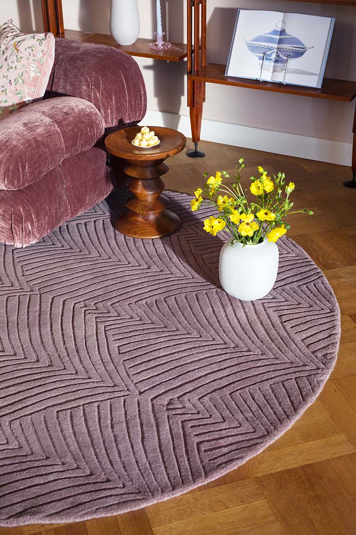 Rectangular mink rug with engraved leaf pattern
