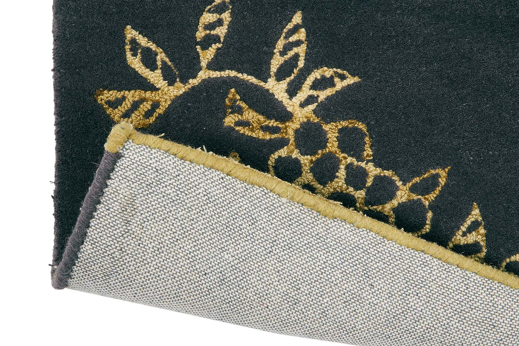 Rectangular black rug with gold floral design